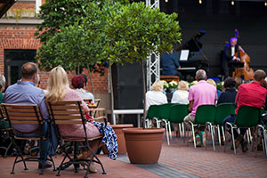 Couple sitting outdoor watching live concert